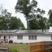 8.6 kw solar electric on left and solar hot water panels on right